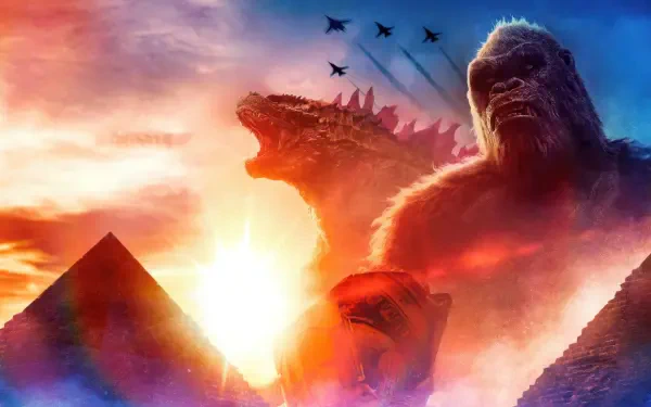Godzilla x Kong: The New Empire 4K Ultra HD PC desktop wallpaper — Kong and Godzilla tower above pyramids at a fiery sunset while jets streak the sky.