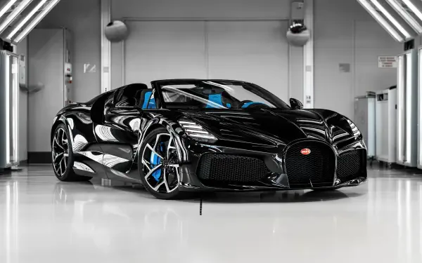 Black Bugatti W16 Mistral hypercar in a glossy showroom, 5K Ultra HD PC desktop wallpaper/background.
