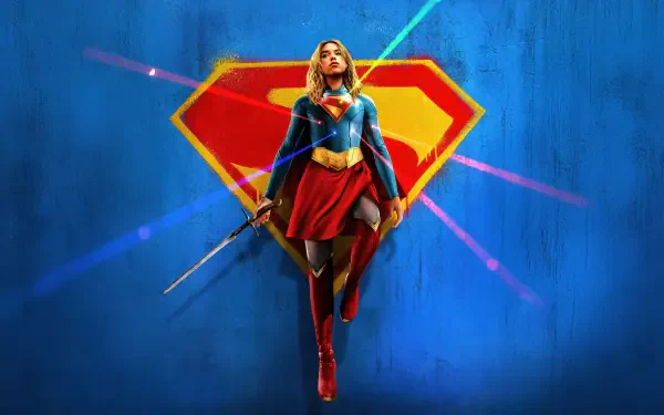 Movie Supergirl (2026) 4K Ultra HD PC desktop wallpaper: Supergirl hovers in a red-and-blue suit before a giant S emblem with neon light streaks on a blue backdrop.