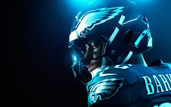 4K Ultra HD PC desktop wallpaper: Madden NFL 26 sports game close-up of an NFL running back in Eagles helmet and jersey, dramatic blue-lit stadium portrait.