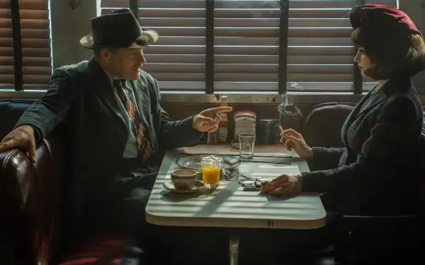 Movie The Bride!: two noir-dressed figures face off in a shadow-striped diner booth—man in fedora pointing, woman in dark hat holding a fork; 5K Ultra HD PC desktop wallpaper/background.
