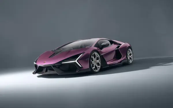 Purple Lamborghini Revuelto on a minimalist grey backdrop — 4K Ultra HD PC desktop wallpaper and background showcasing a sleek purple supercar.