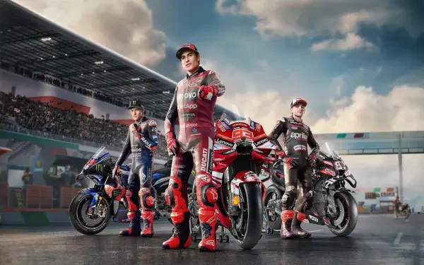 4K Ultra HD PC desktop wallpaper of MotoGP 26: three motorcycle racers in full leathers beside their bikes on the starting grid at a packed circuit, high-detail motorcycle racing scene.