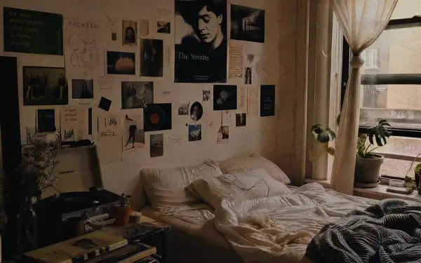 Cozy indie aesthetic bedroom: rumpled bed, collage of posters and photos above, potted plants by a curtained window — 4K Ultra HD PC Desktop Wallpaper and Background.
