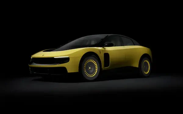Sleek yellow Ferrari Luce vehicle in dramatic low light against a black background — 4K Ultra HD PC desktop wallpaper and background.