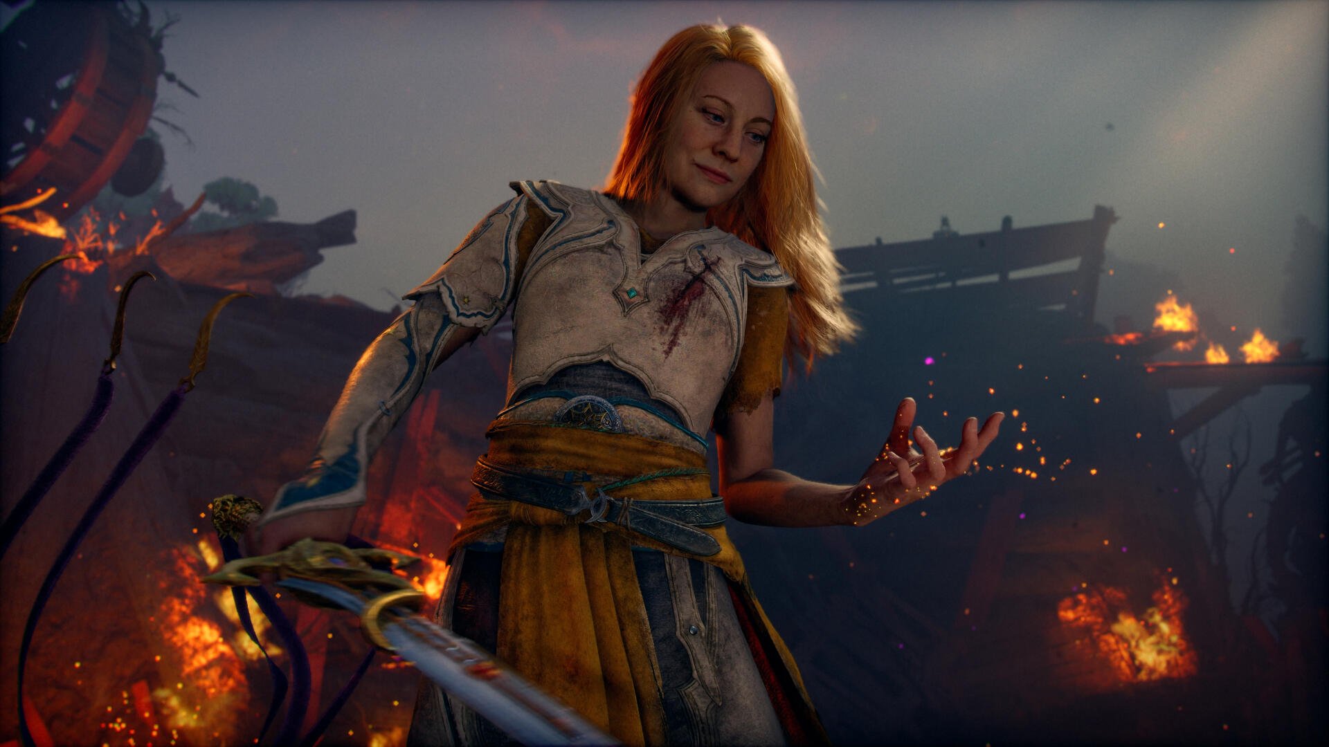 4K Ultra HD PC desktop wallpaper of Laufey from the God of War video game, standing amid burning ruins with blonde hair, holding a sword as embers glow around her.