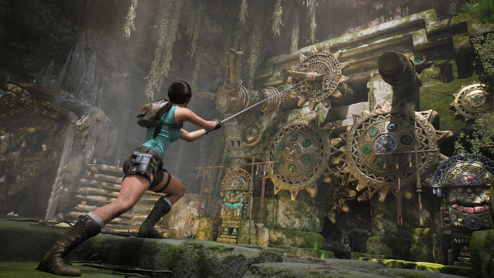 Lara Croft from the video game Tomb Raider: Legacy of Atlantis pulls a rope to turn massive moss-covered gears in an ancient ruin — 4K Ultra HD PC desktop wallpaper/background.