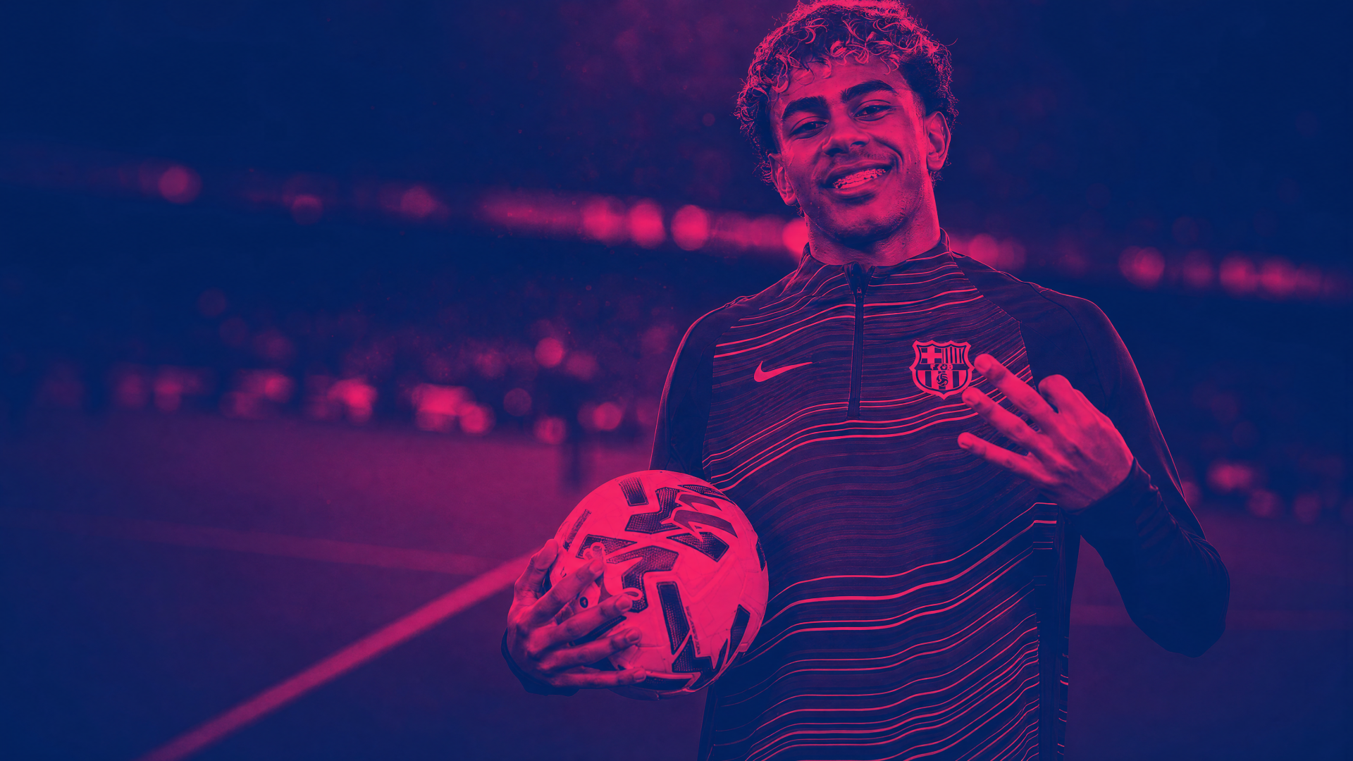 4K Ultra HD PC desktop wallpaper of a smiling footballer holding a soccer ball, wearing a striped training top under magenta-blue stadium lighting.