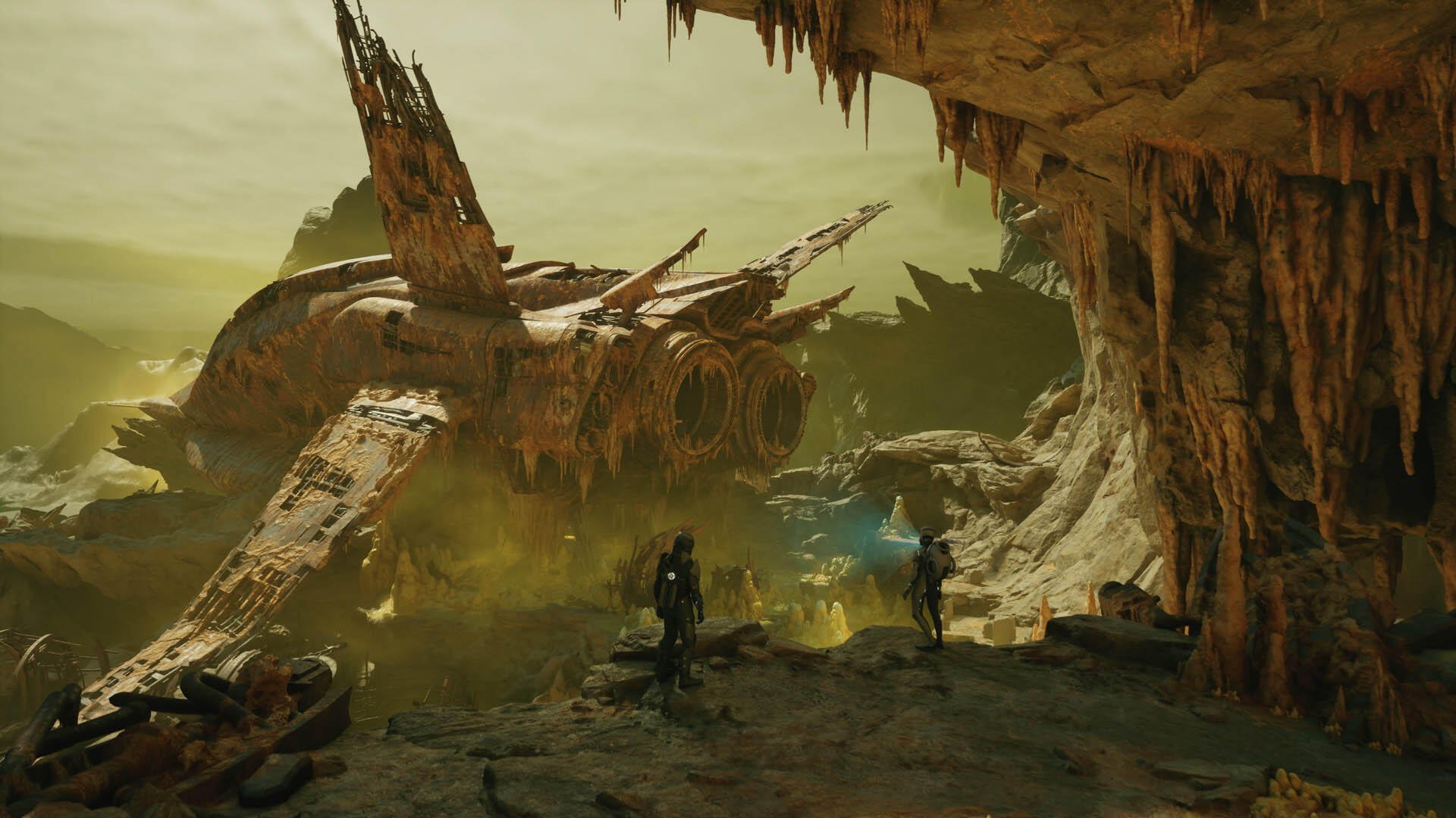 HD PC desktop wallpaper and background for Exodus (2027 Video Game): two explorers stand by a crashed starship inside a misty green alien cavern with jagged stalactites.