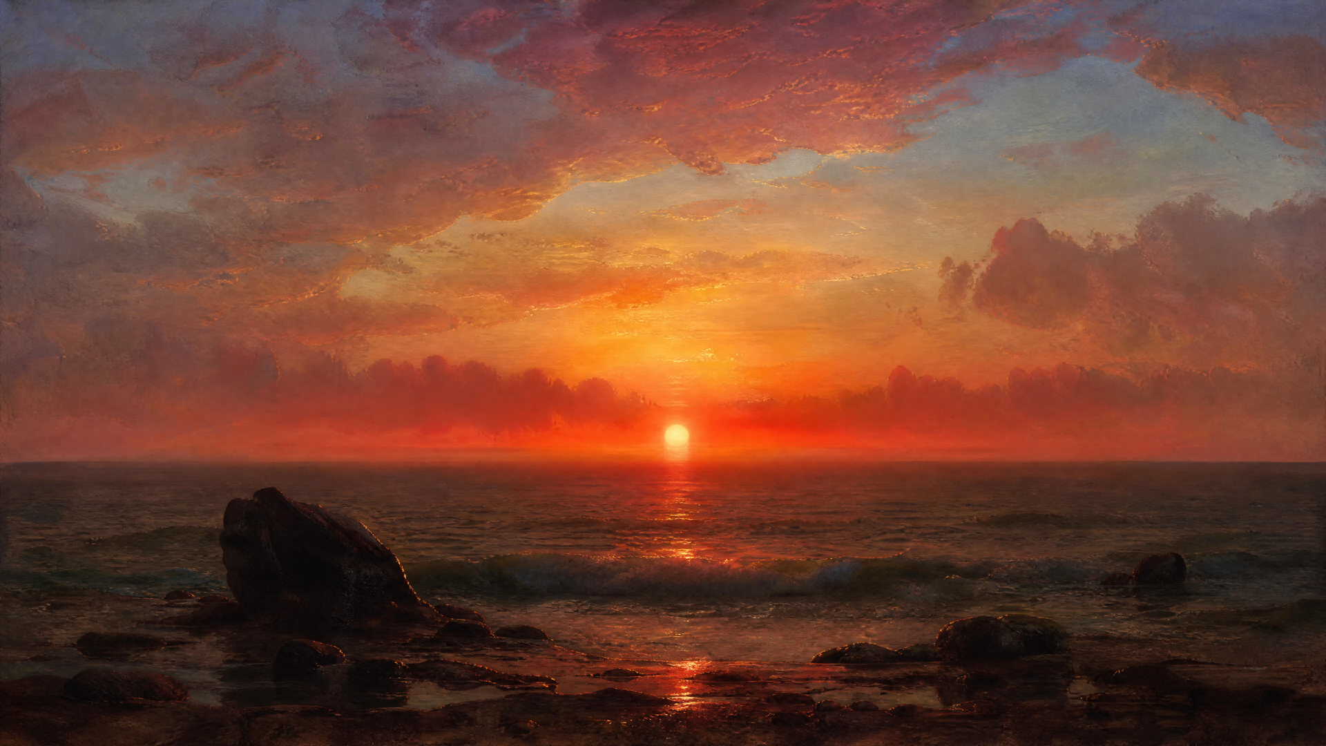 4K Ultra HD PC desktop wallpaper showing an ocean sunset: glowing sun on the horizon, colorful clouds and waves lapping a rocky shore.