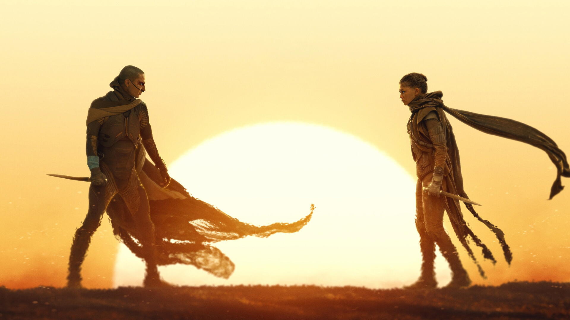 Dune: Part Three — 4K Ultra HD PC Desktop Wallpaper and Background of two robed figures confronting each other before a massive desert sunset, wind-torn cloaks and long shadows.