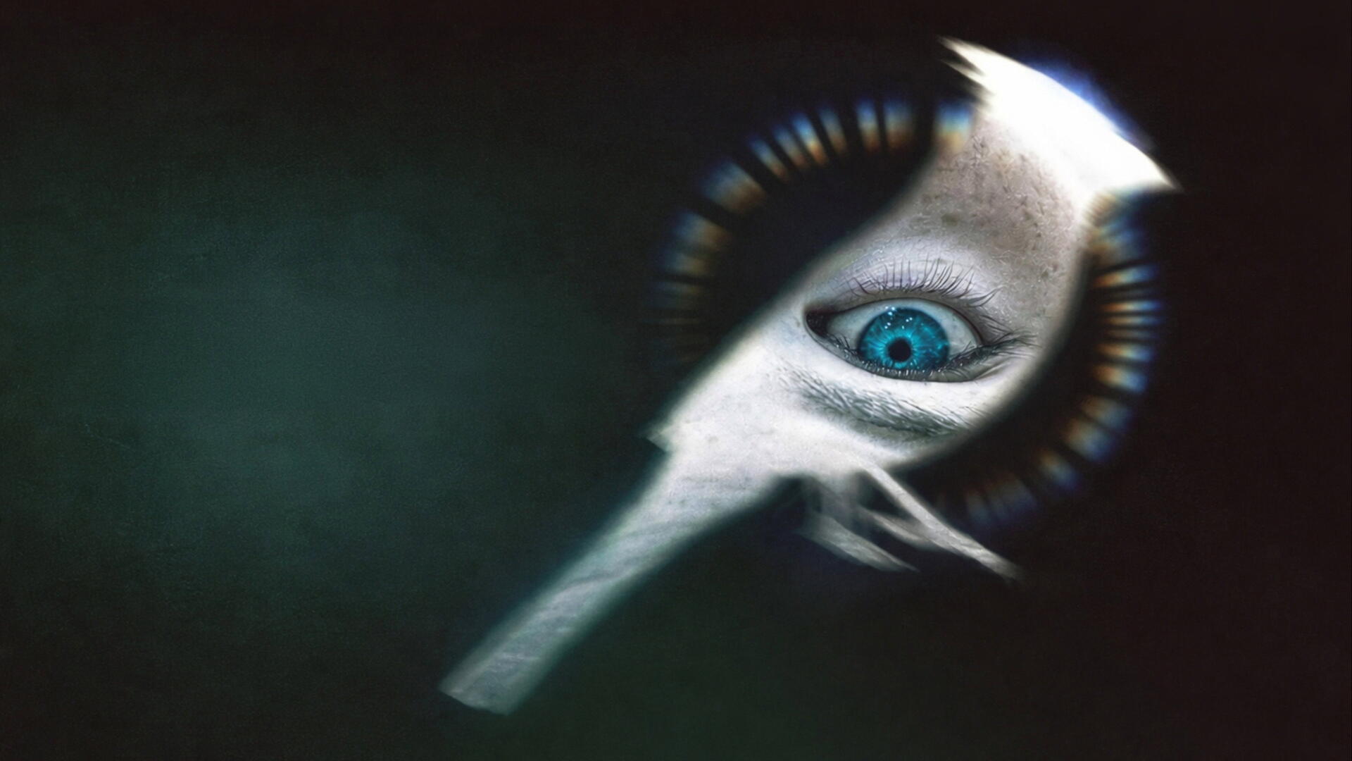 Disclosure Day 4K Ultra HD PC desktop wallpaper: surreal turquoise eye embedded in a white, elongated mask-like form against a dark, grainy green background.