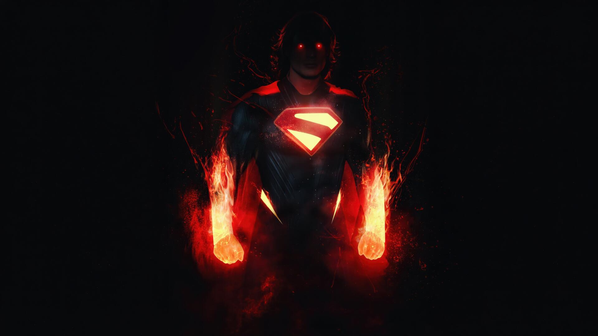 4K Ultra HD PC desktop wallpaper of Superman: shadowed hero with glowing red S-emblem and fiery hands breaking from darkness.
