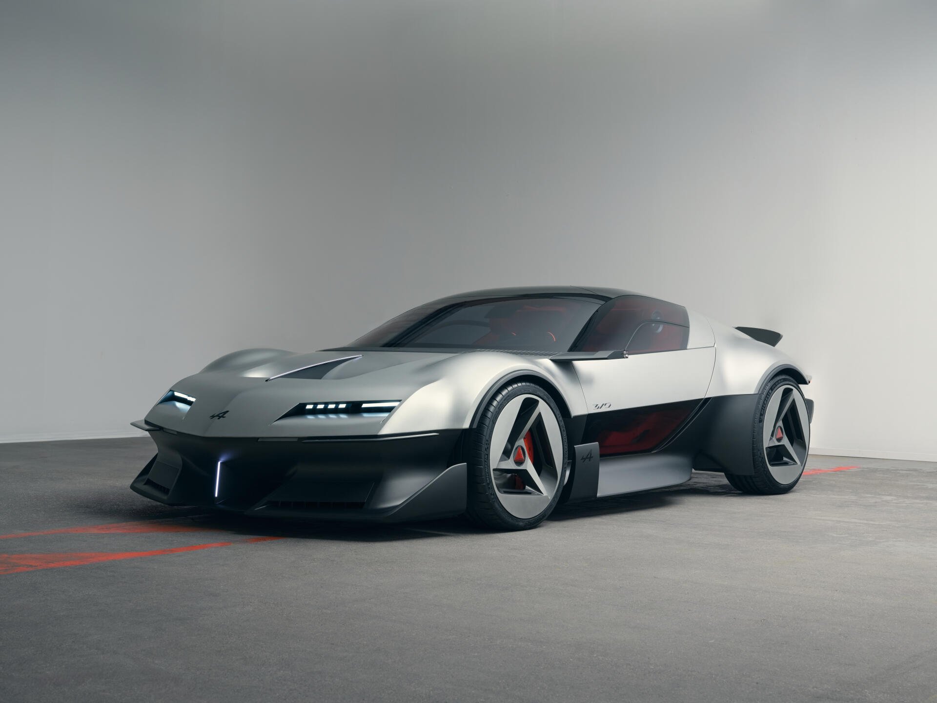 Alpine A310 Vision electric concept car in a sleek studio setting, featured in a 5K Ultra HD PC desktop wallpaper and background.