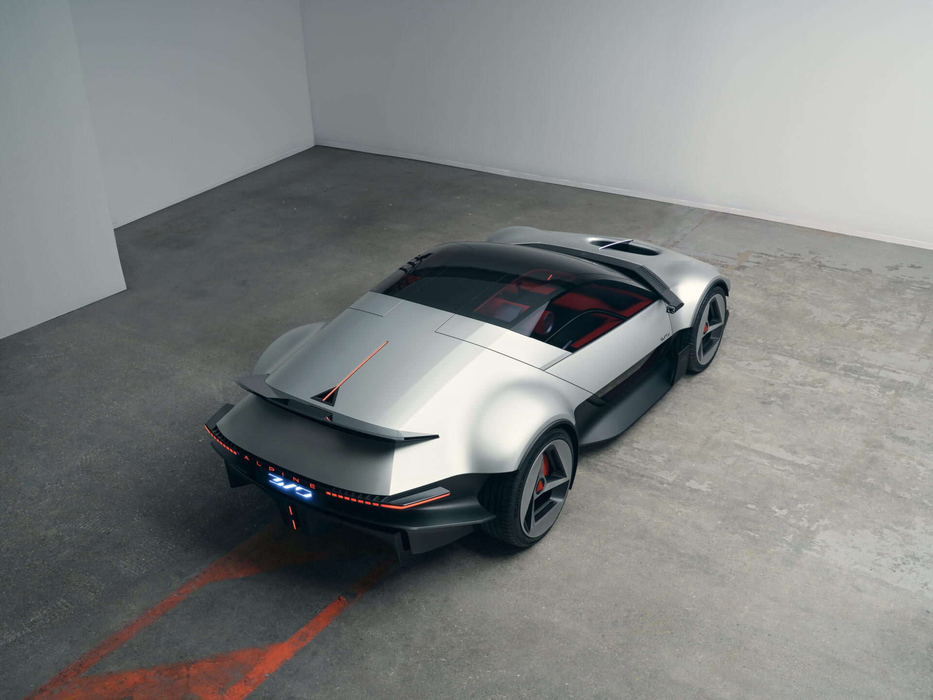 Silver Alpine A310 Vision concept sports car in a sleek rear three-quarter view, featured in a 5K Ultra HD desktop wallpaper.
