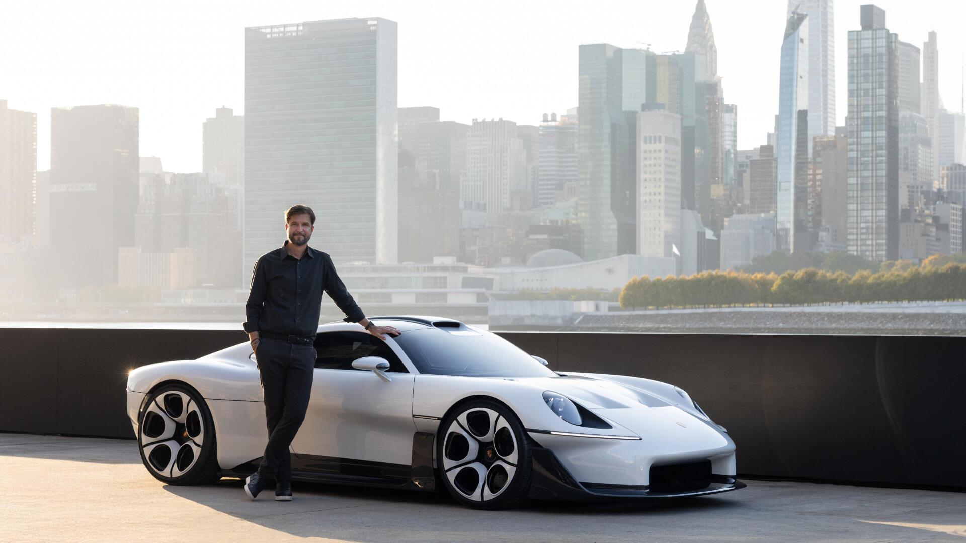 White Porsche Mission S electric sports car and man against a city skyline, 5K Ultra HD desktop wallpaper.