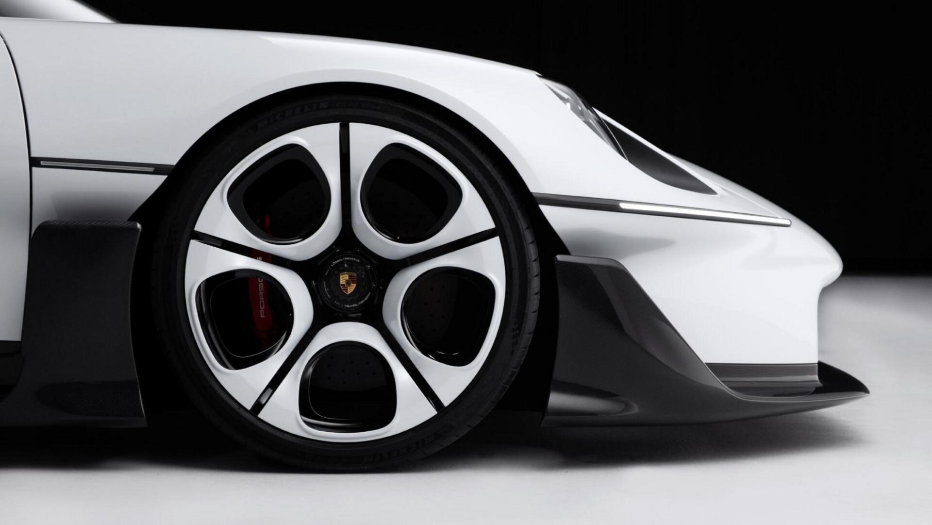 Close-up of a Porsche Mission S sports car wheel against a white body, featured in an HD PC desktop wallpaper and background.