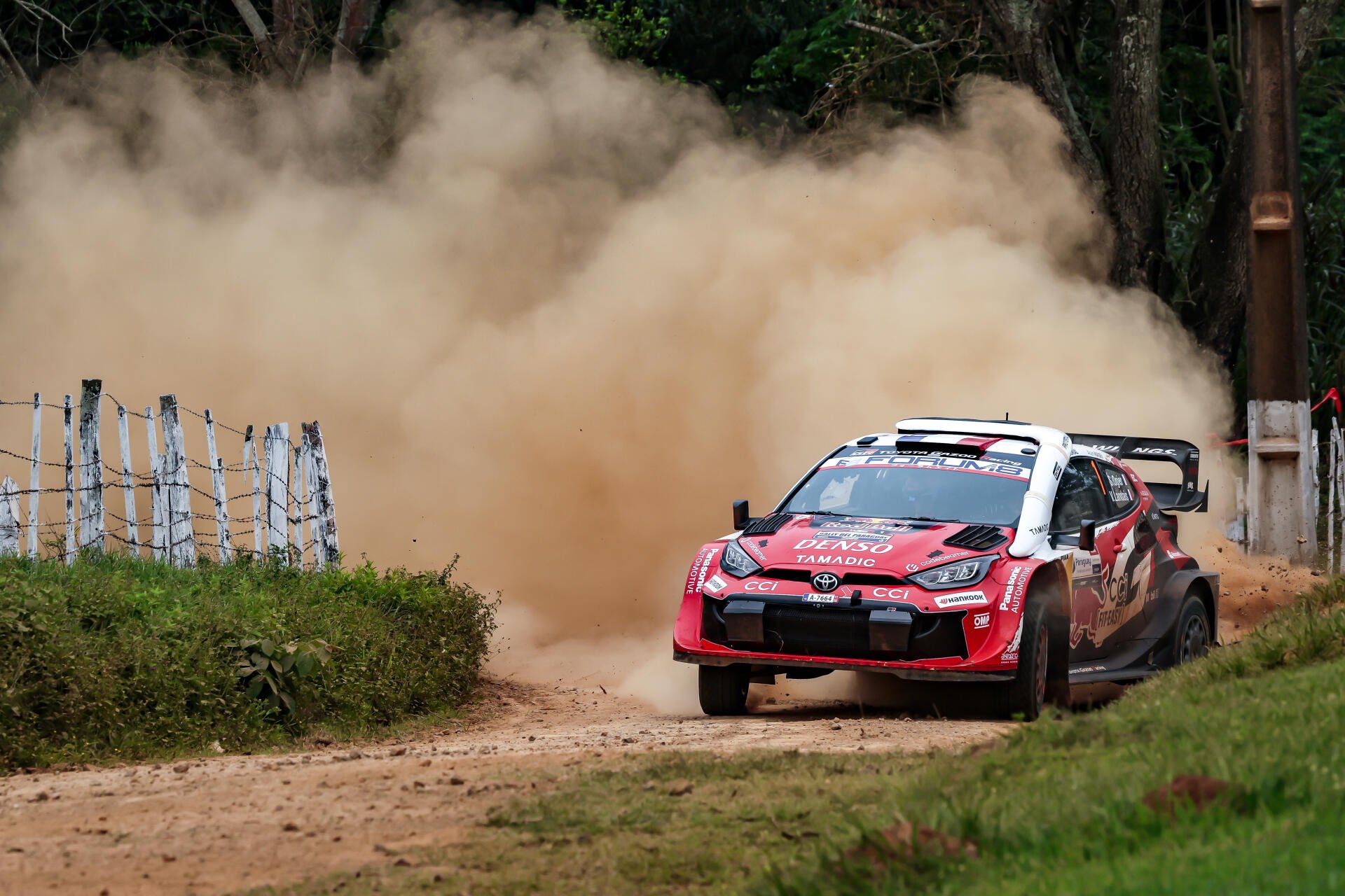 Toyota Gazoo Racing GR Yaris Rally1 kicking up dust on a forest WRC stage, 5K Ultra HD desktop wallpaper