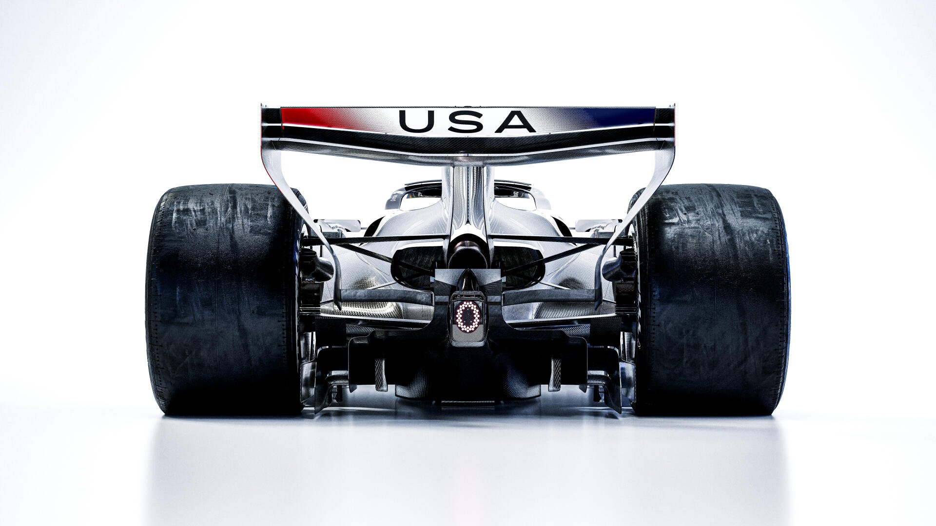Rear view of the Cadillac MAC-26 F1 race car with USA rear wing, featured in an 8K Ultra HD desktop wallpaper.