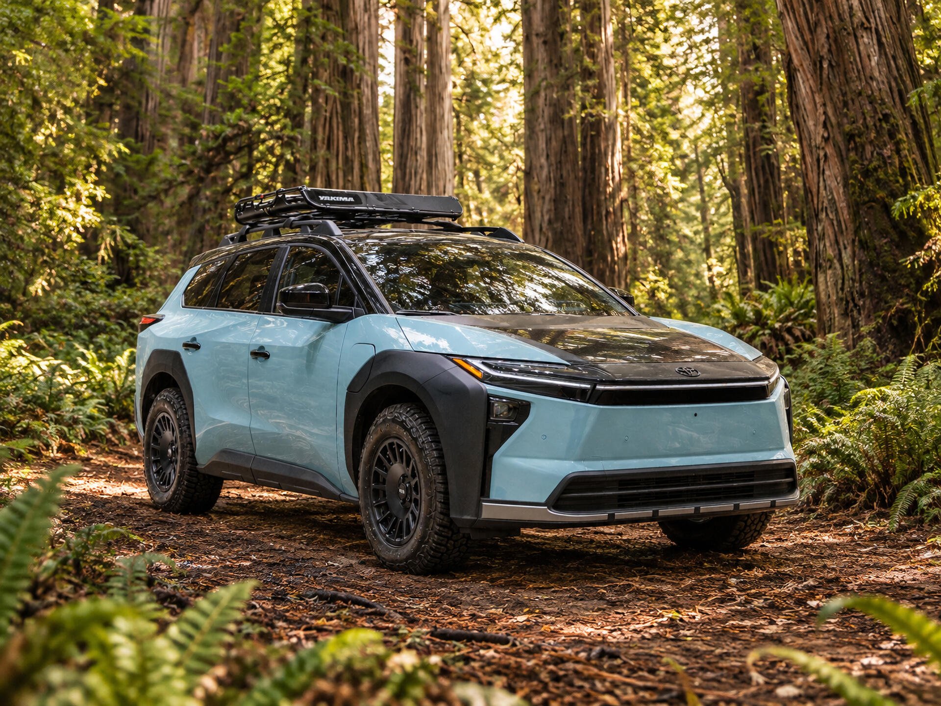 Toyota bZ Woodland Concept electric SUV parked in a forest, 2K Quad HD desktop wallpaper and background.