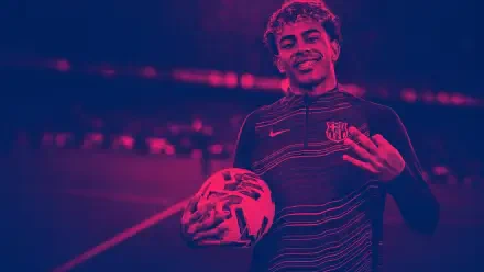 4K Ultra HD PC desktop wallpaper of a smiling footballer holding a soccer ball, wearing a striped training top under magenta-blue stadium lighting.