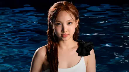 Close-up of a red-haired woman in a white swimsuit, waist‑deep in dark water, K-pop–inspired 5K Ultra HD PC desktop wallpaper background.