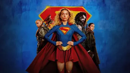 Supergirl (2026) 4K Ultra HD PC desktop wallpaper: Supergirl stands center in red cape and 'S' emblem, flanked by three allies against a textured blue background.