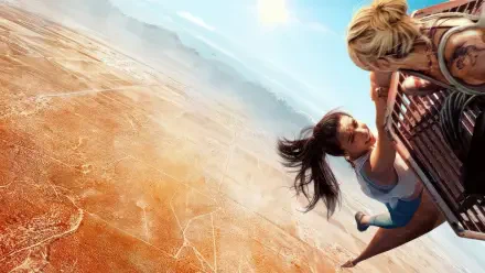 Vertigo 4K Ultra HD PC desktop wallpaper: two figures clutch a railing, hanging over a dizzying desert abyss with a sweeping sky and dramatic downward perspective.