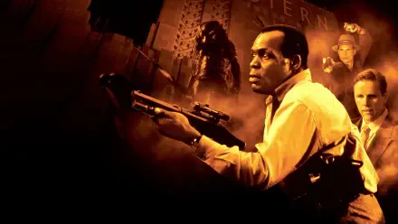 Predator 2 4K Ultra HD PC desktop wallpaper: tense city scene with a man aiming a rifle, Predator silhouette looming behind him and shadowy figures in warm orange tones.