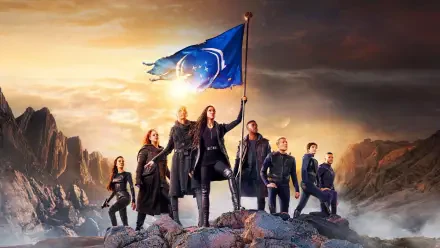 Star Trek: Discovery 4K Ultra HD PC desktop wallpaper — crew on a rocky ridge beneath a dramatic sky as the captain raises a flag bearing the Starfleet emblem.