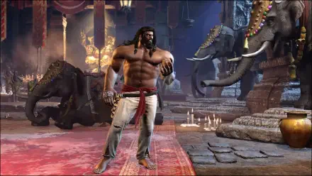 Street Fighter 6 HD PC desktop wallpaper: Arjun, bare-chested warrior in a temple, fists raised, candles lit and elephants looming behind him.