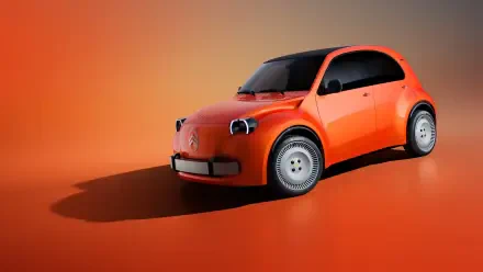 Orange Citroën 2CV concept car with a Volkswagen badge on a warm studio background, HD desktop wallpaper.