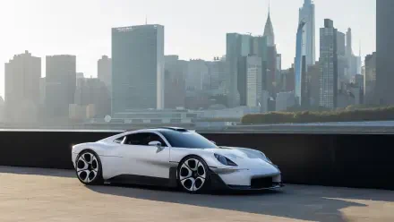 White Porsche Mission S luxury sports car against a city skyline, 5K Ultra HD desktop wallpaper and background.