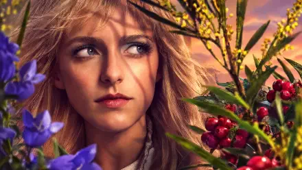 Maysilee Donner from The Hunger Games in a floral portrait, 4K Ultra HD PC desktop wallpaper and background.