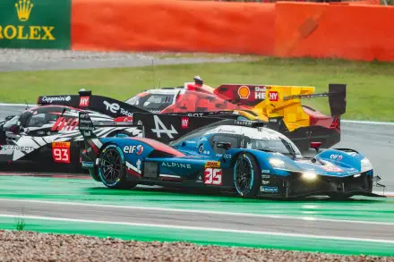 Alpine A424 race car battling on track in an auto racing scene, featured in a 5K Ultra HD PC desktop wallpaper.
