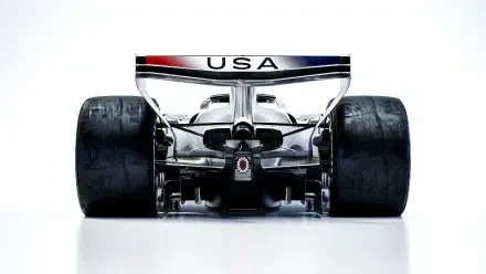 Rear view of the Cadillac MAC-26 F1 race car with USA rear wing, featured in an 8K Ultra HD desktop wallpaper.