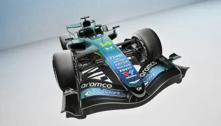 Aston Martin AMR26 Formula One race car in teal and black, featured in a 2K Quad HD desktop wallpaper.