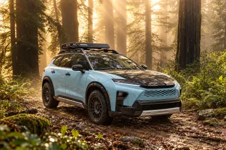 Toyota Crown Signia Woodland Concept SUV on a forest trail, featured in a 2K Quad HD PC desktop wallpaper and background.