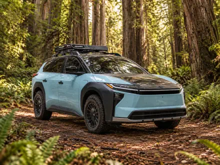 Toyota bZ Woodland Concept electric SUV parked in a forest, 2K Quad HD desktop wallpaper and background.