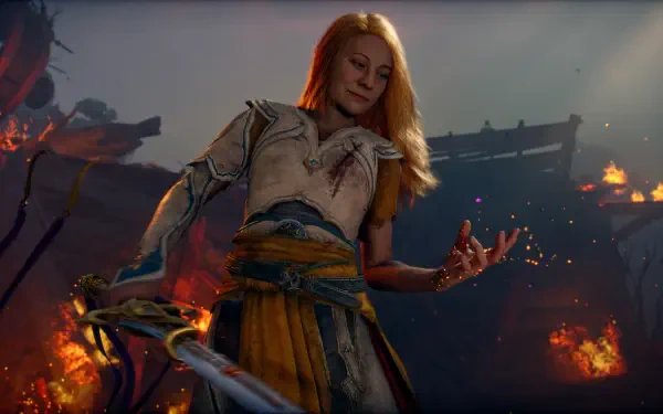 4K Ultra HD PC desktop wallpaper of Laufey from the God of War video game, standing amid burning ruins with blonde hair, holding a sword as embers glow around her.