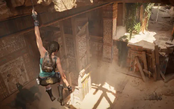 Video game 4K Ultra HD PC wallpaper of Lara Croft from Tomb Raider: Legacy of Atlantis leaping into a sunlit ancient tomb, ropes and carved walls casting dramatic shadows.