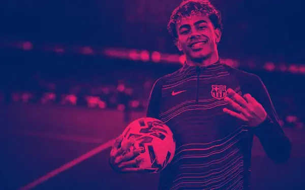 4K Ultra HD PC desktop wallpaper of a smiling footballer holding a soccer ball, wearing a striped training top under magenta-blue stadium lighting.