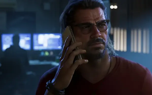 Raul Bautista from Grand Theft Auto VI in a moody 4K Ultra HD PC desktop wallpaper, holding a phone in a dim control-room, video game background.