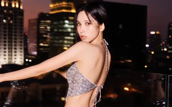 Japanese K-pop singer and model posing on a city rooftop at night in a sparkly backless top — 5K Ultra HD PC desktop wallpaper and background.