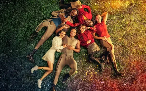 Star Trek: Starfleet Academy ensemble lying on a colorful grassy field in a vibrant 4K Ultra HD PC desktop wallpaper, rainbow lighting and relaxed group portrait evoking Star Trek atmosphere.