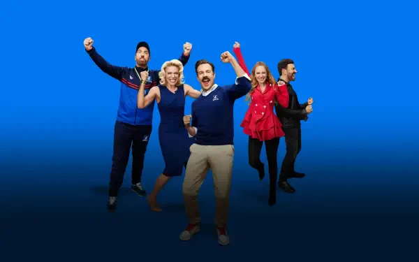 Ted Lasso 4K Ultra HD PC desktop wallpaper: upbeat ensemble of show characters cheering on a clean blue gradient background.