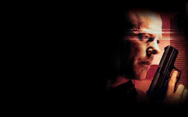 Close-up of a tense man holding a handgun against a dark background with red-orange rim lighting; 24 tag. 4K Ultra HD PC desktop wallpaper and background.
