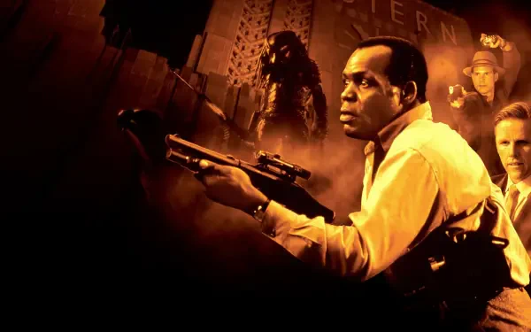 Predator 2 4K Ultra HD PC desktop wallpaper: tense city scene with a man aiming a rifle, Predator silhouette looming behind him and shadowy figures in warm orange tones.