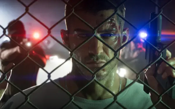 4K Ultra HD PC wallpaper: Jason, a man from the Grand Theft Auto VI video game, stares through a chain-link fence as police lights flash and officers aim guns.