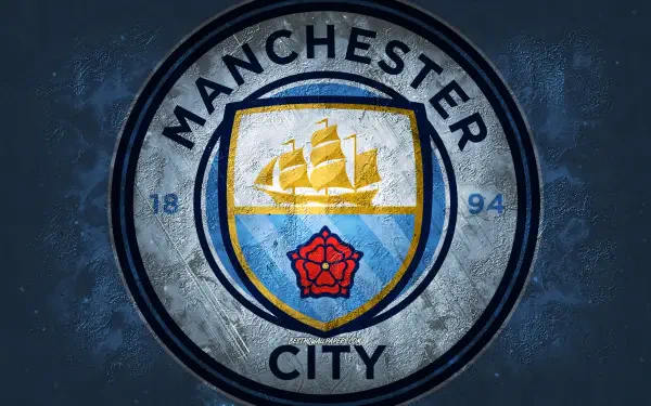 Manchester City F.C. logo on a worn blue textured circular shield, centered — 2K Quad HD PC desktop wallpaper and background.